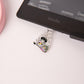 Kindle Raccoon Dust Plug